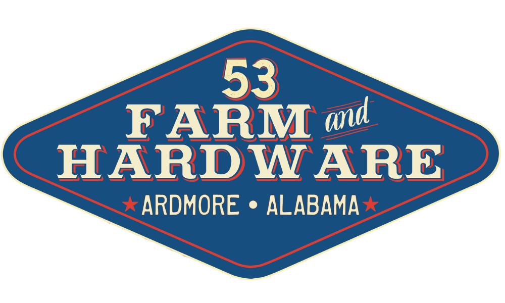 Vintage diamond-shaped sign reading “53 Farm and Hardware, Ardmore, Alabama,” in bold cream, red, and blue lettering; rustic Americana tone.