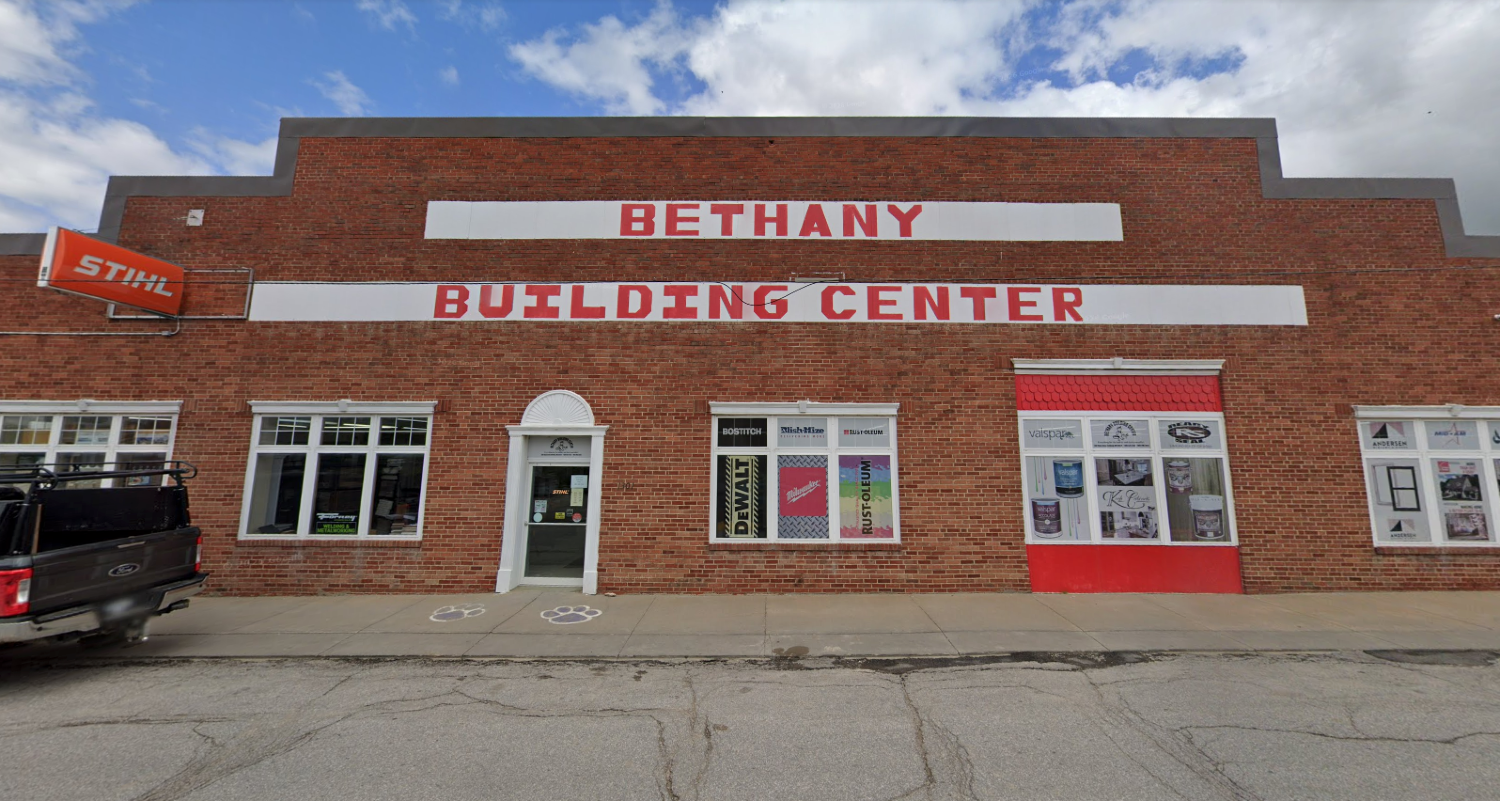 Cartoon builder holding a saw, smiling under the arc of text "Bethany Building Center." Caption reads, "Everything for the builder and do-it-yourselfer!"